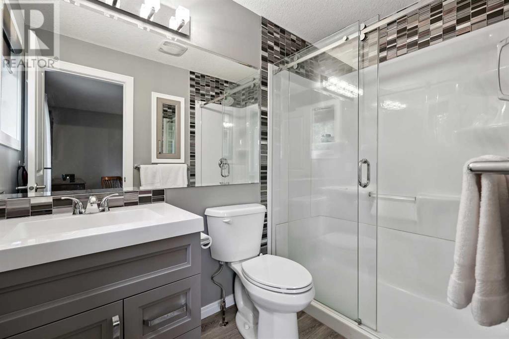 Single Family House 4 Level for Sale in  Hawkcliff Way NW Hawkwood Calgary 