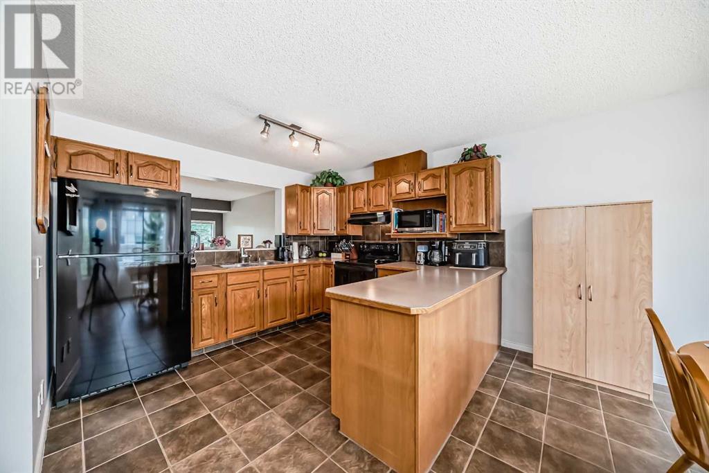 Single Family House 4 Level for Sale in  Kingsland Court SW Kingsland Calgary 