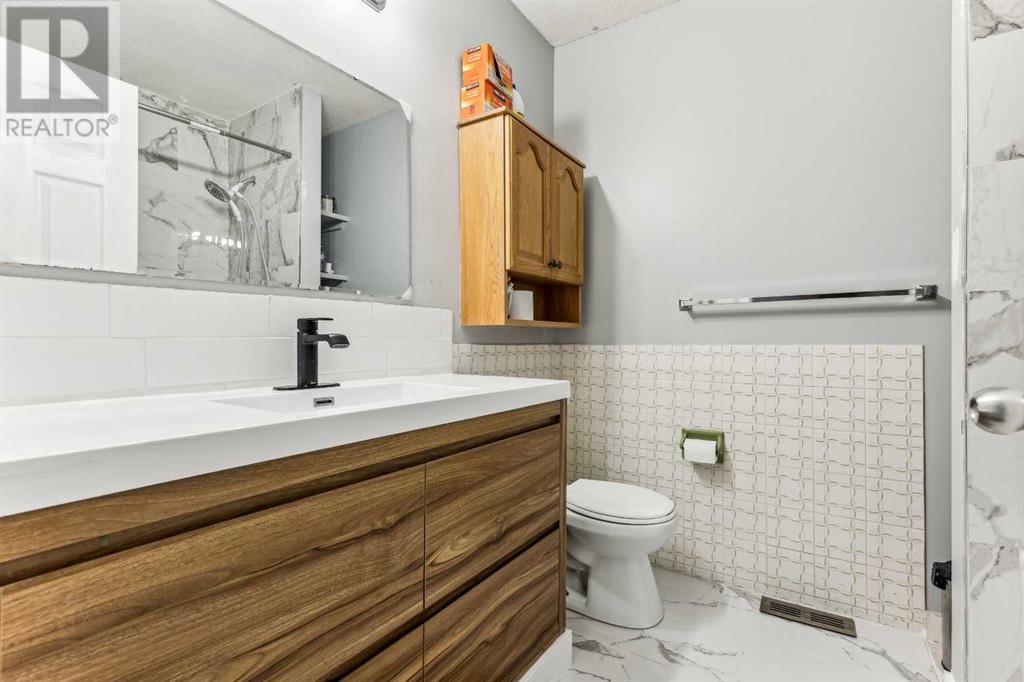 Single Family House Bi-level for Sale in  Ranchero Rise NW Ranchlands Calgary 