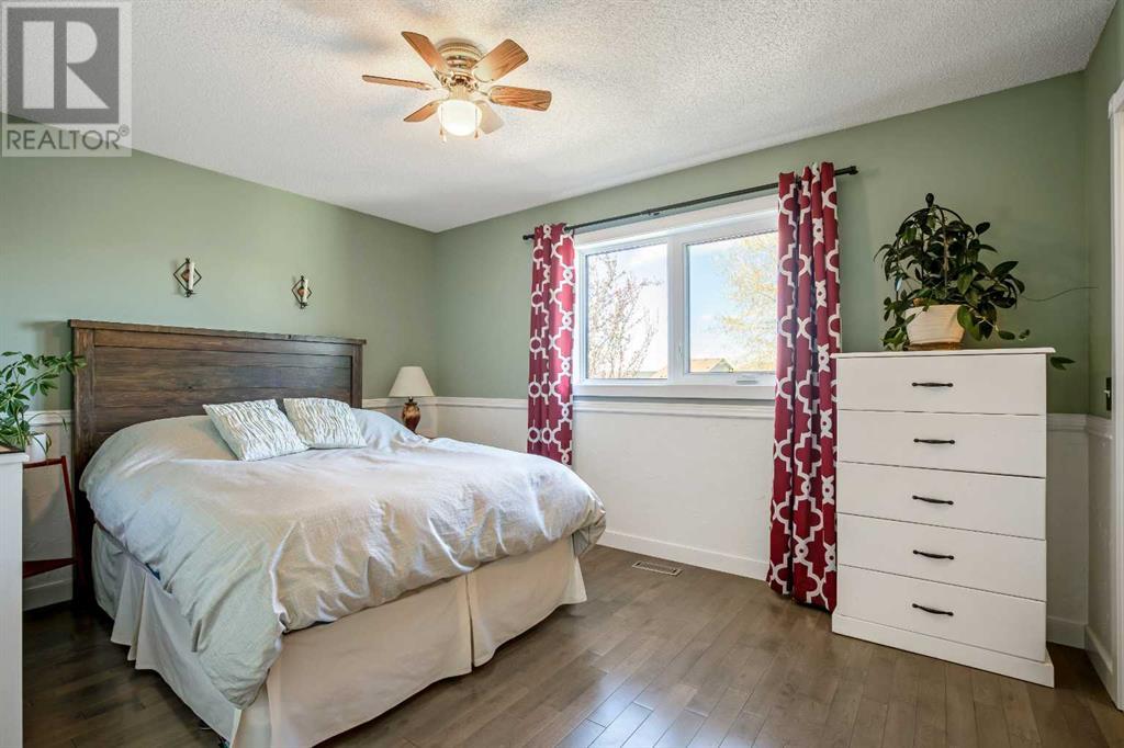 Single Family House Bi-level for Sale in  Arbour Wood Mews NW Arbour Lake Calgary 