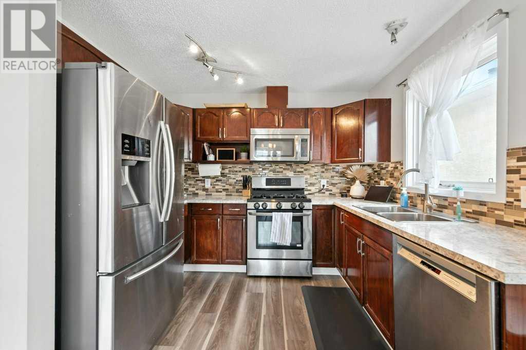 Single Family House 3 Level for Sale in  Macewan Ridge Place NW MacEwan Glen Calgary 