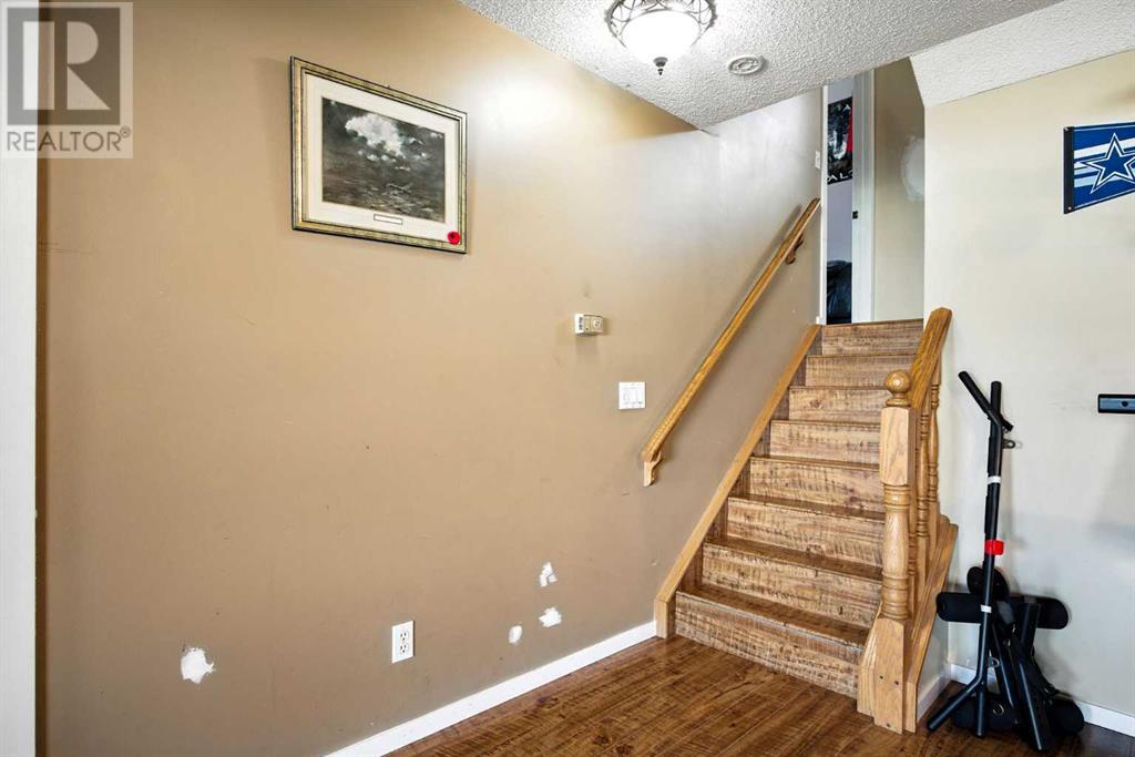 Single Family House 3 Level for Sale in  Riverstone Close SE Riverbend Calgary 