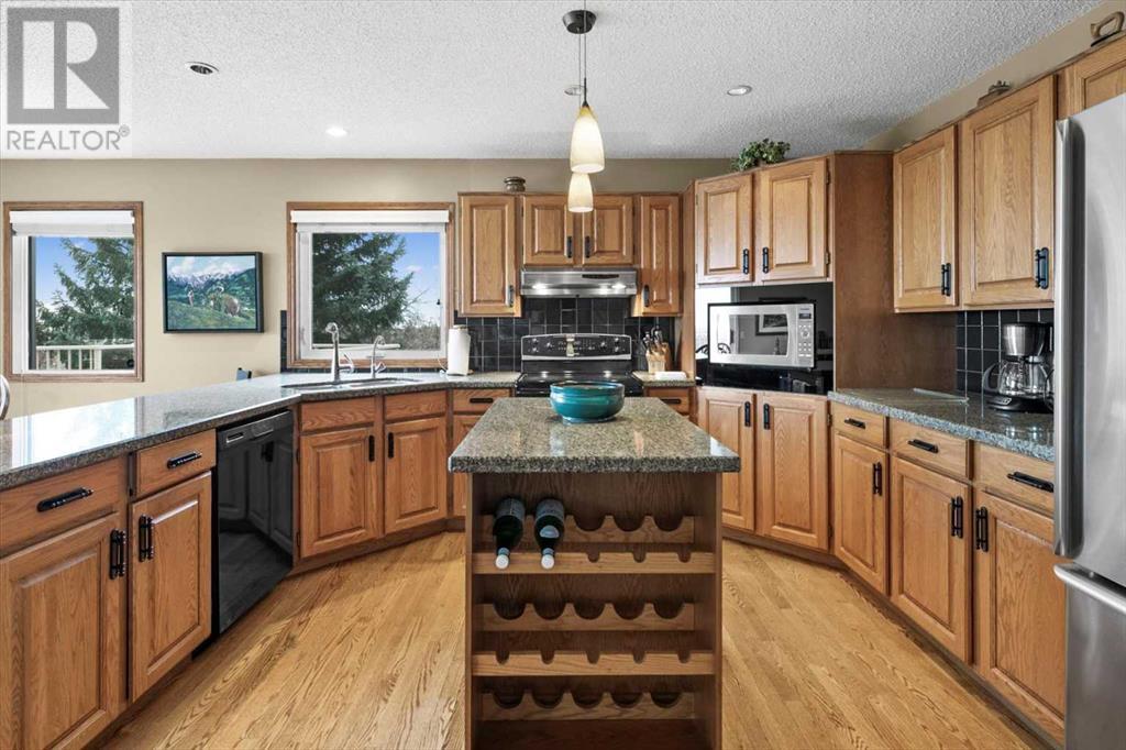 Single Family House 4 Level for Sale in  Strathaven Mews SW Strathcona Park Calgary 