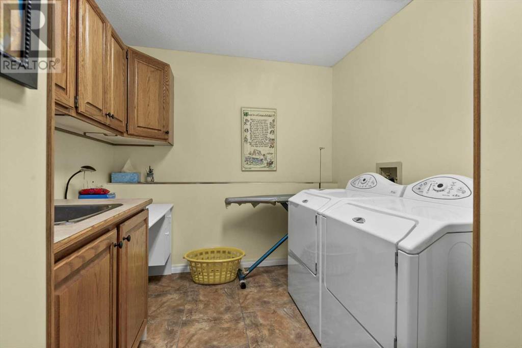Single Family House 4 Level for Sale in  Strathaven Mews SW Strathcona Park Calgary 