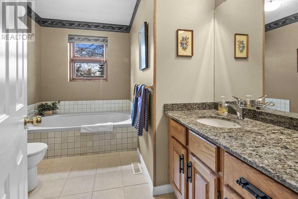 Single Family House 4 Level for Sale in  Strathaven Mews SW Strathcona Park Calgary 