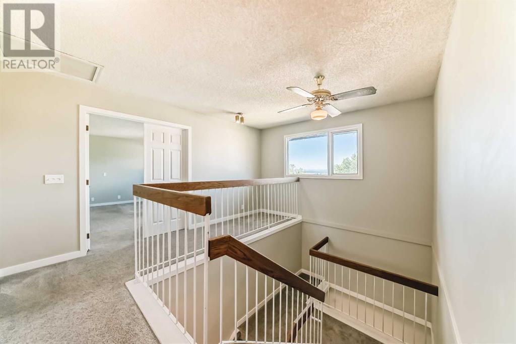 Single Family House 4 Level for Sale in  Hawksbrow Drive NW Hawkwood Calgary 
