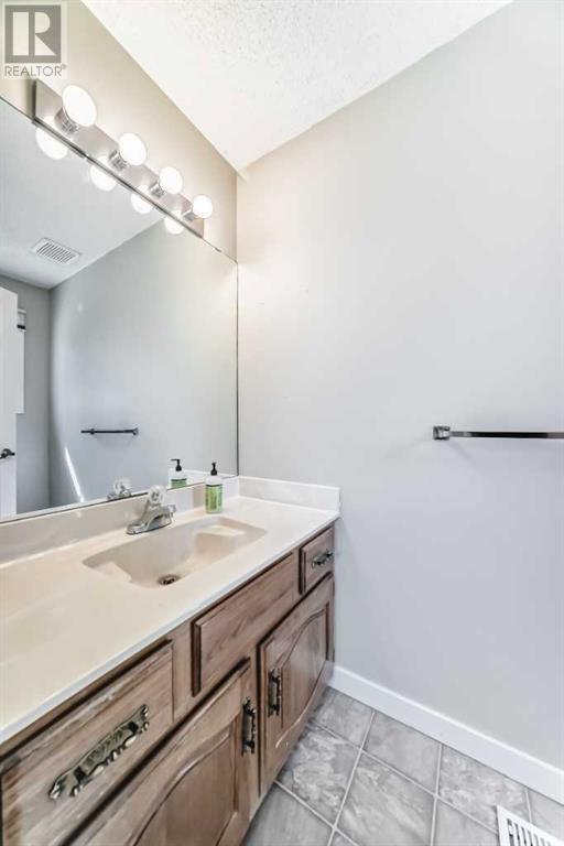 Single Family House 4 Level for Sale in  Hawksbrow Drive NW Hawkwood Calgary 