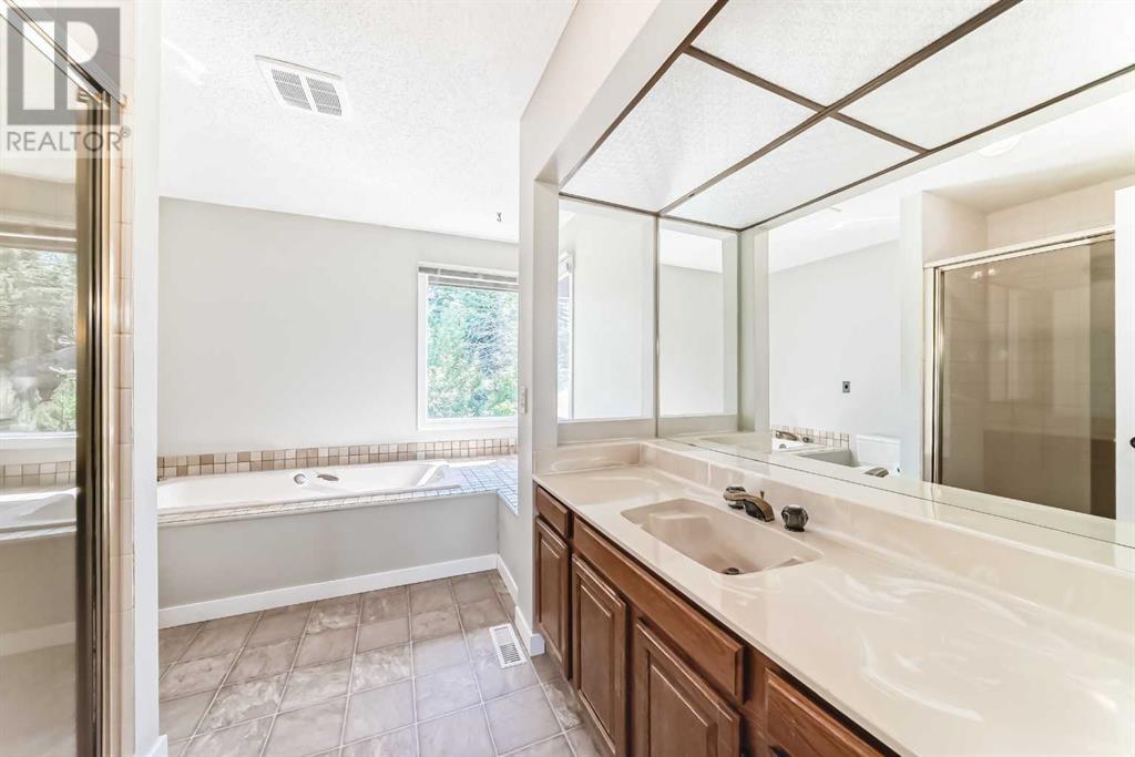 Single Family House 4 Level for Sale in  Hawksbrow Drive NW Hawkwood Calgary 