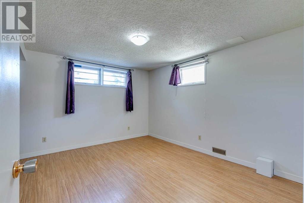 Single Family House Bi-level for Sale in  Canfield Way SW Canyon Meadows Calgary 