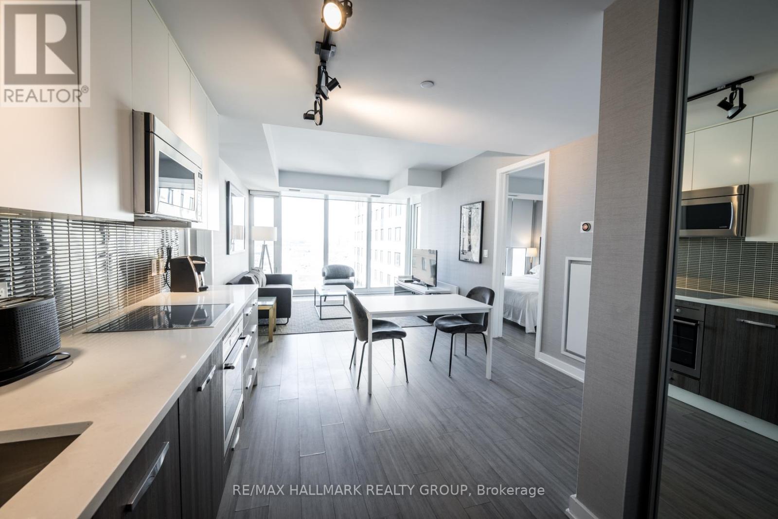 Kitchen and Living Room w/Floor to Ceiling Windows