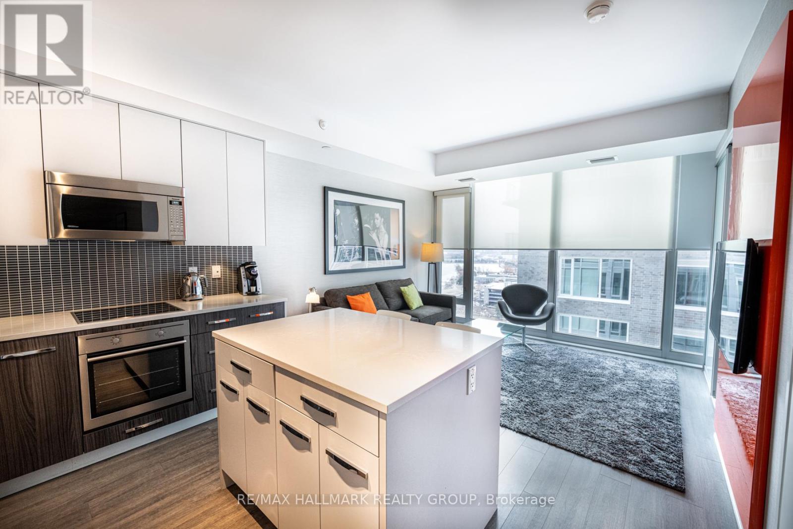 Kitchen and Living Room w/Floor to Ceiling Windows