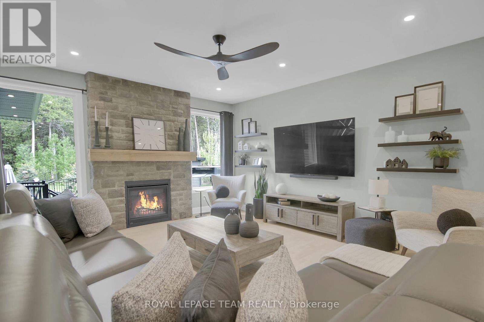 Greatroom with floor to ceiling stone fireplace!