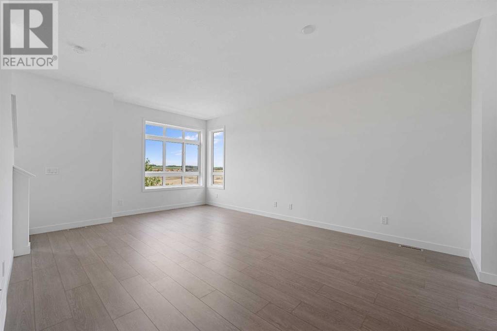 Single Family House for Sale in   Belmont Drive SW Belmont Calgary 
