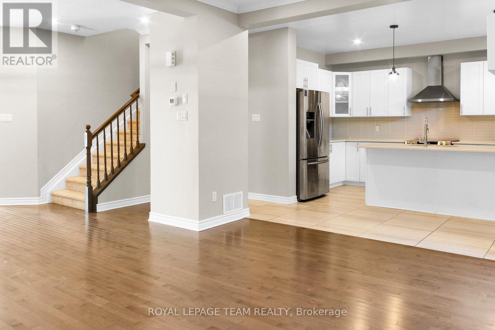 living room to kitchen and stair case
