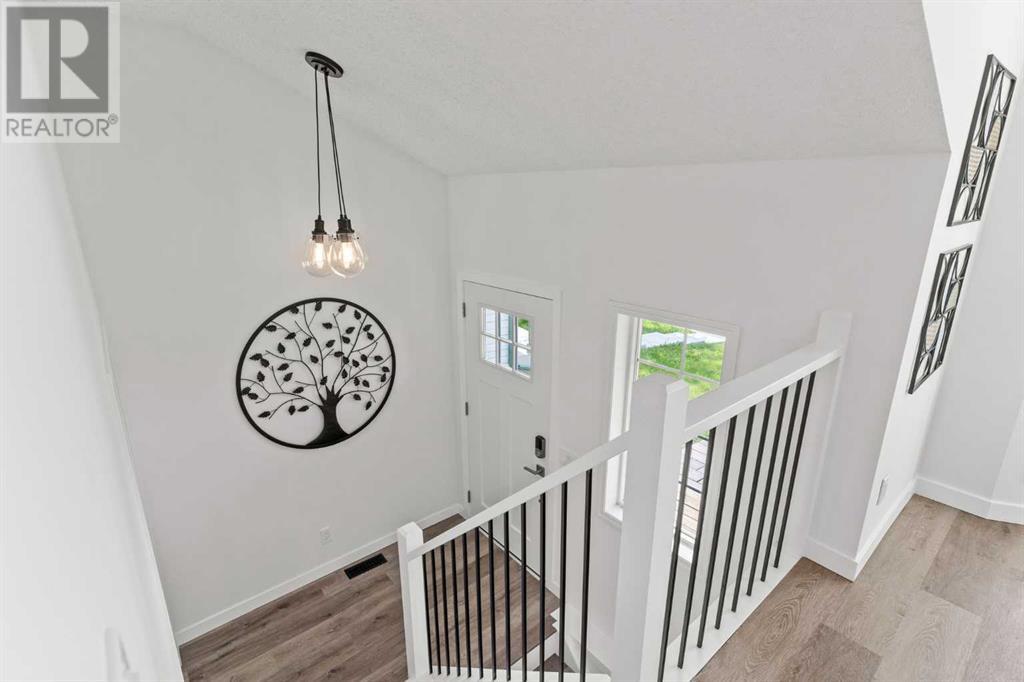 Single Family House Bi-level for Sale in  Mt Aberdeen Close SE McKenzie Lake Calgary 