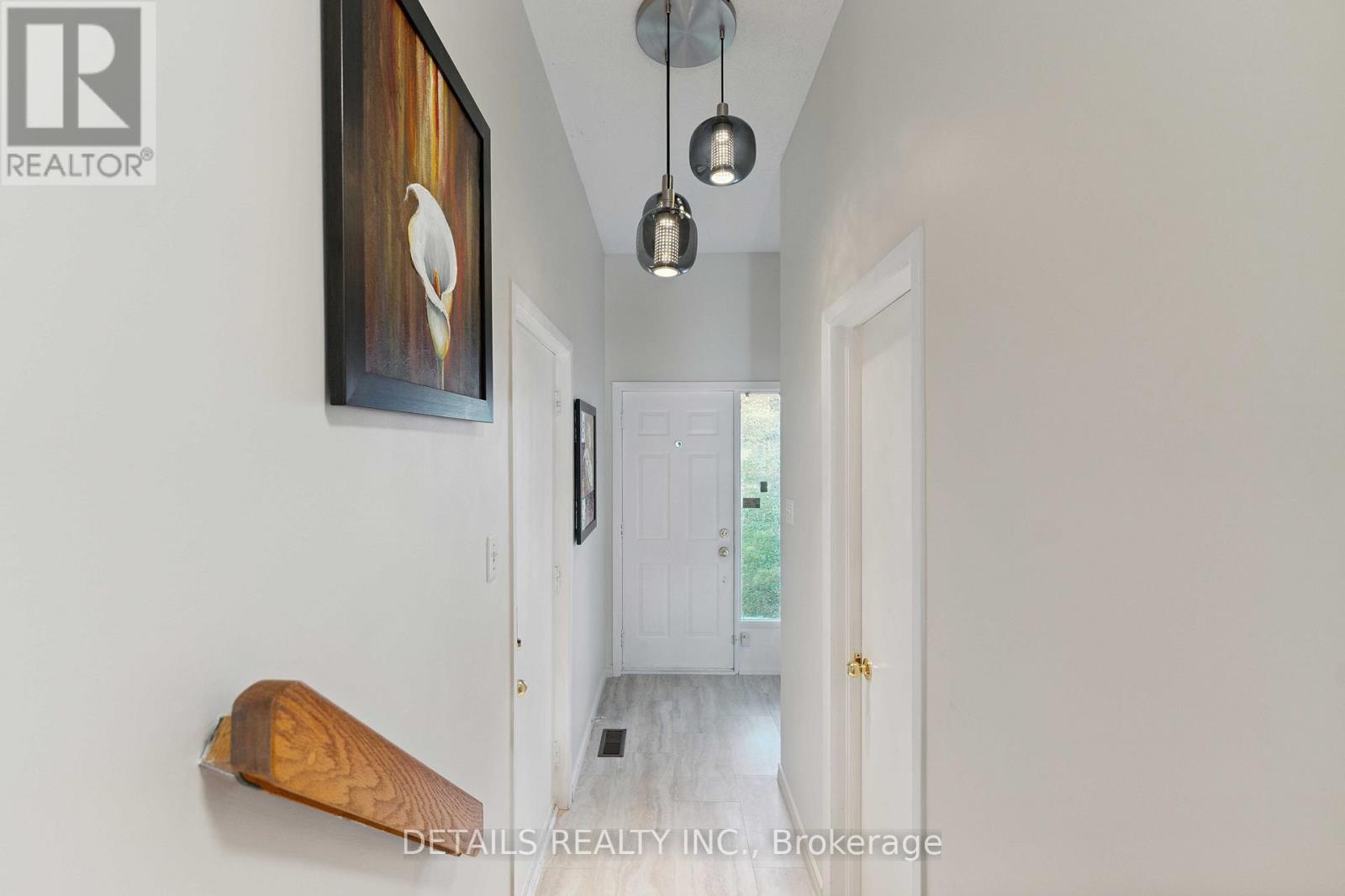Foyer w access to garage and powder room