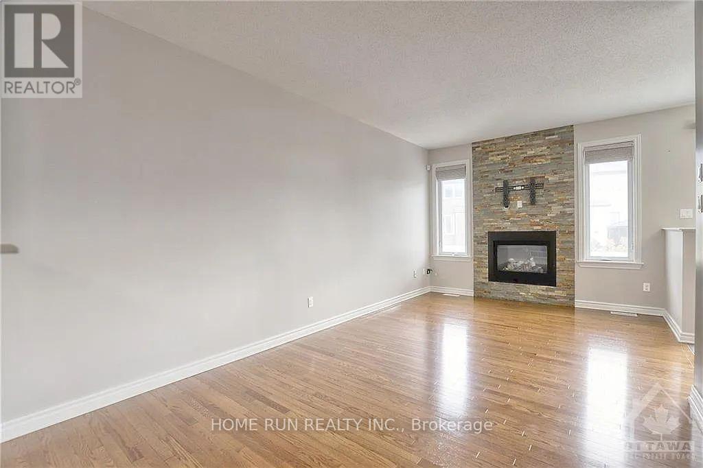 Living room with fireplace and hardwood floors