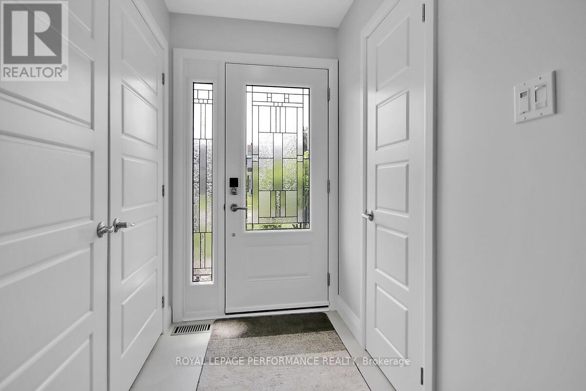 Renovated foyer with a stunning front door.