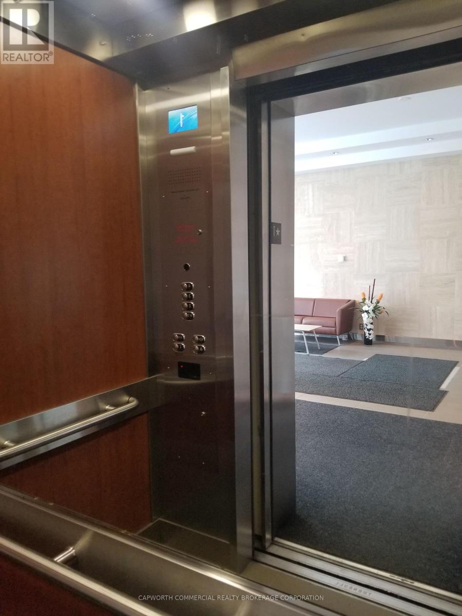 Mirrored Interior, Cherry Wood Elevator