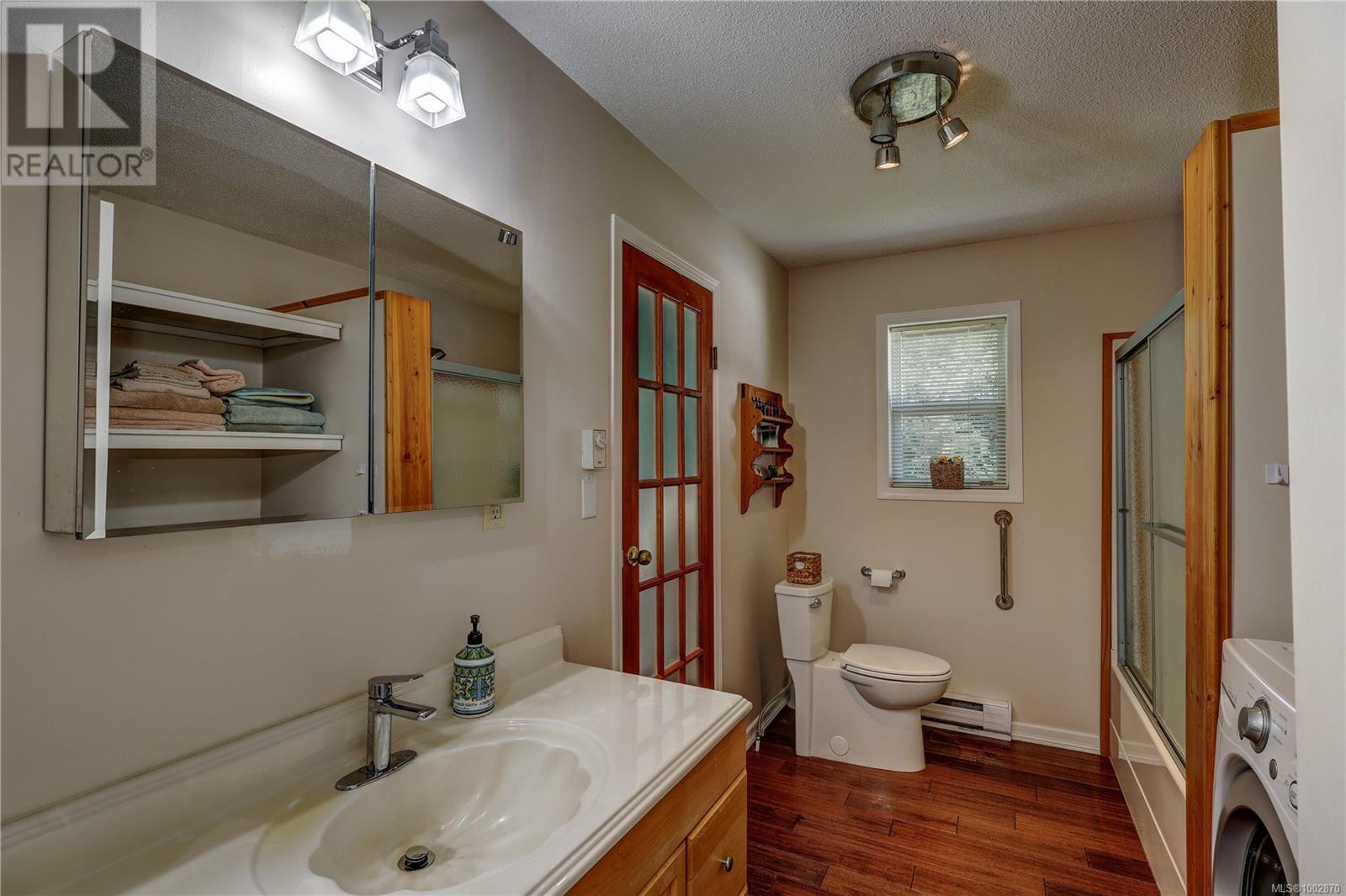 Photo 4 of 4840 Blue Heron Dr, Bowser BC