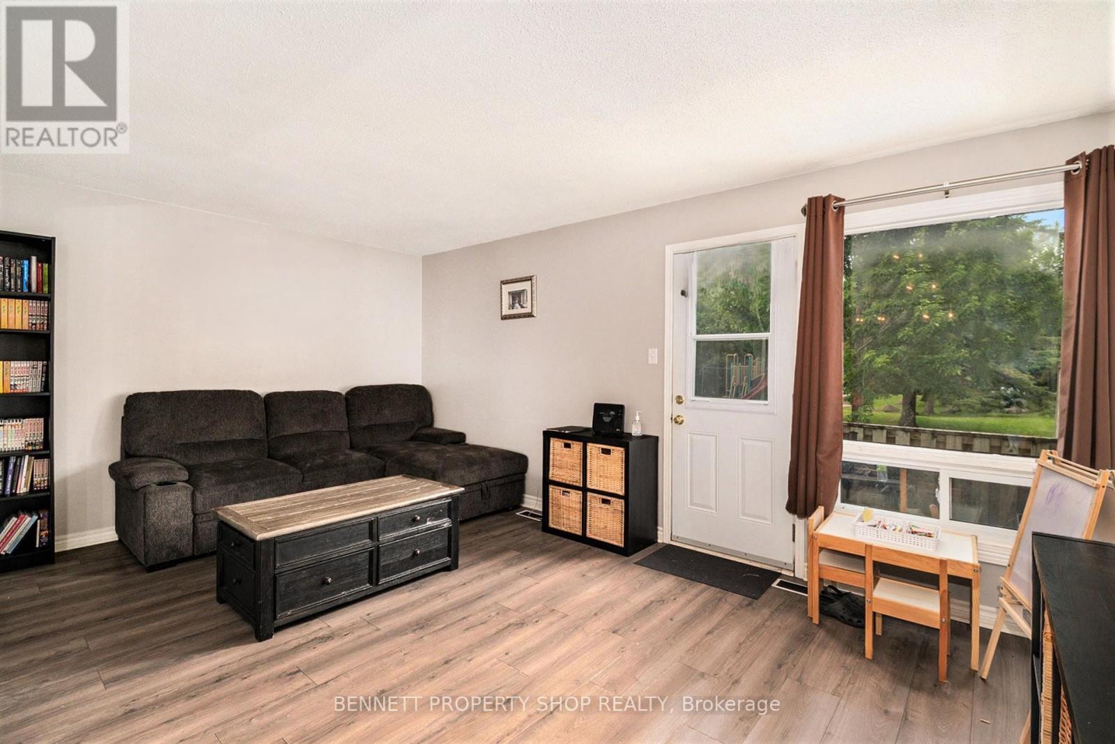 Living area - large window overlooks yard & park