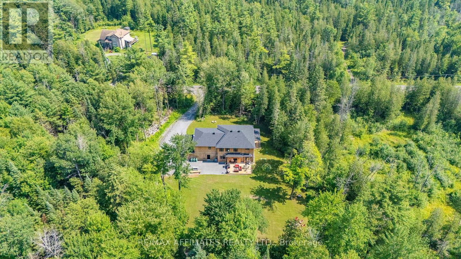Located on a sprawling 1.996-Acre Treed lot!