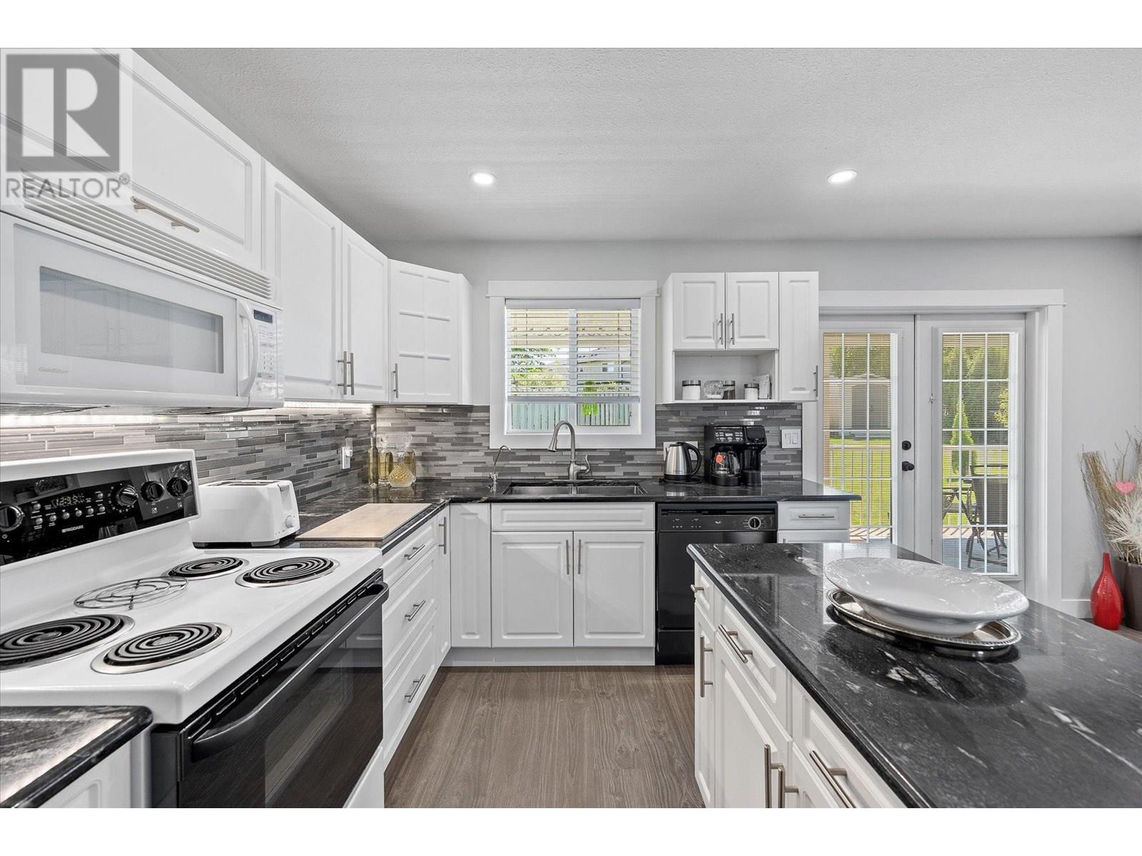 Photo 11 of 135 Almond Court, Kelowna BC