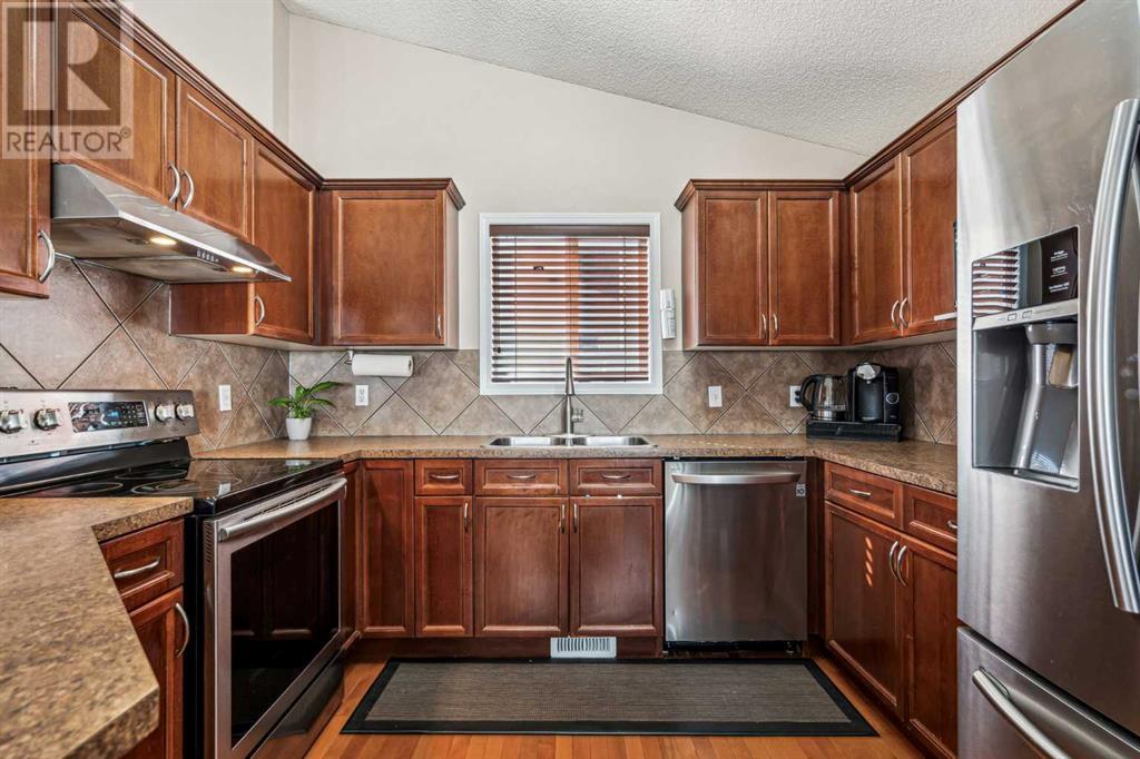 Single Family House Bi-level for Sale in  Covepark Place NE Coventry Hills Calgary 