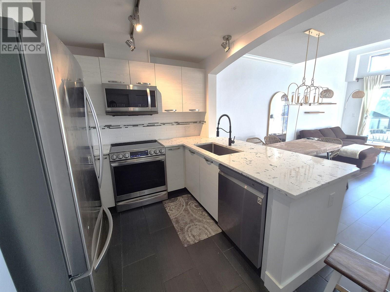 Photo 2 of 405 7478 Byrnepark Walk, Burnaby BC