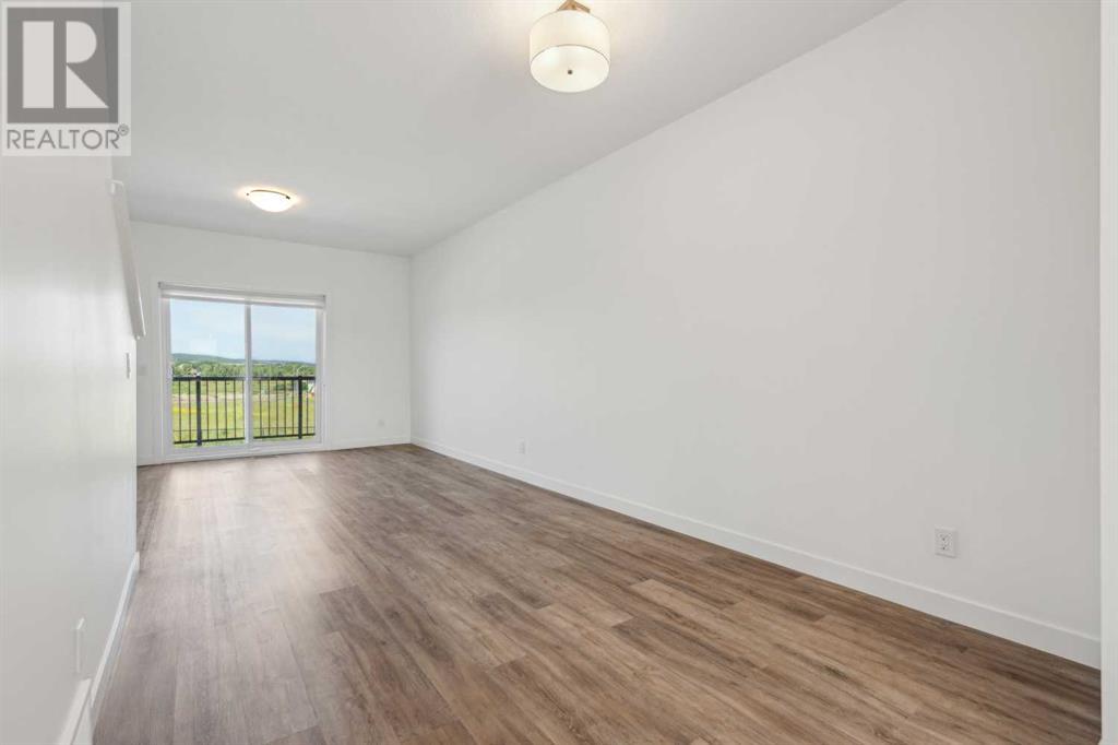 Photo 12 of 202 24 Rivercrest Drive, Cochrane AB