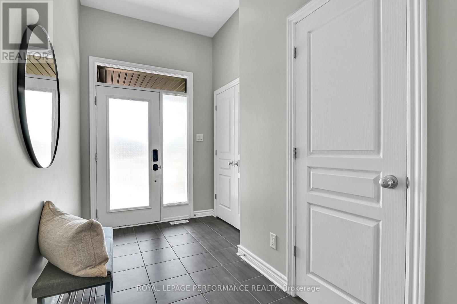Modern foyer with easy care tile flooring.