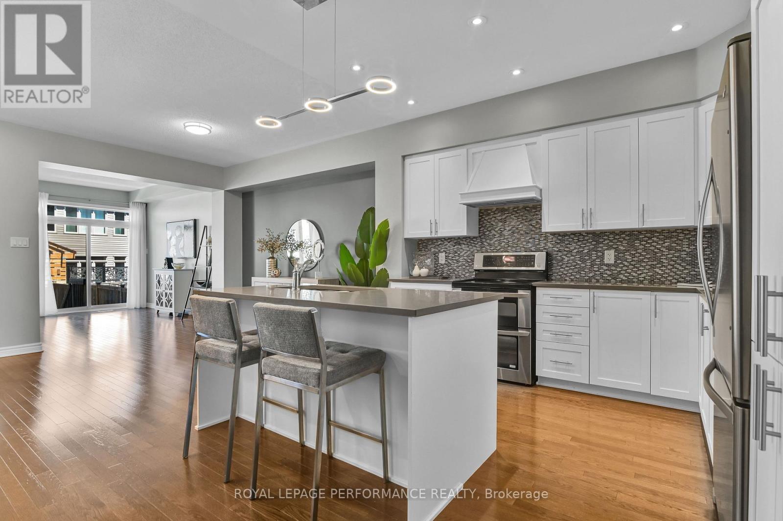 Open concept kitchen with convenient island.
