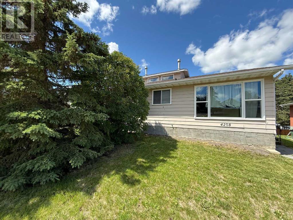 Photo 1 of 4206 4208 44 Street, Ponoka AB