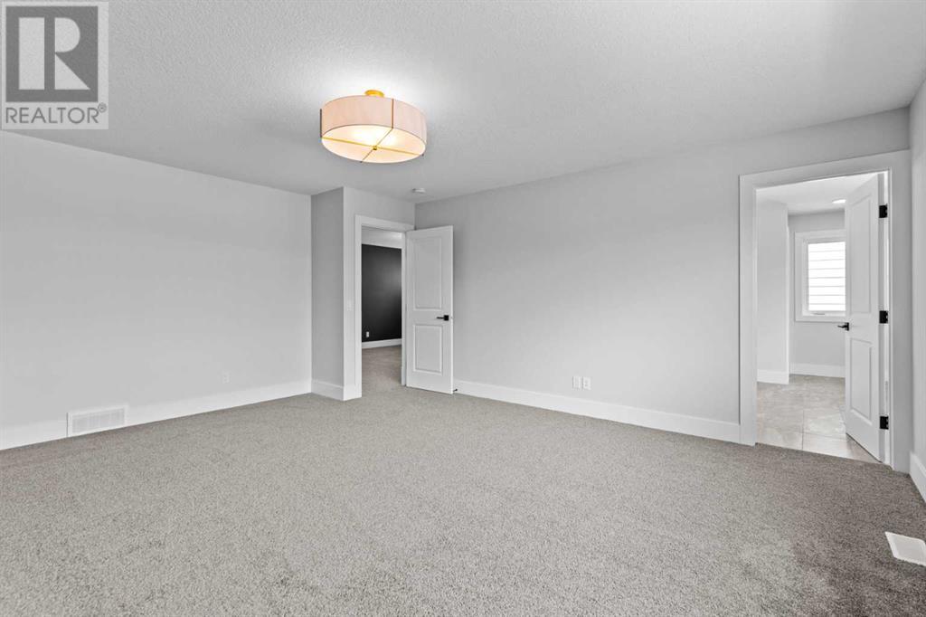 Photo 4 of 205 Creekstone Hill Sw, Calgary AB