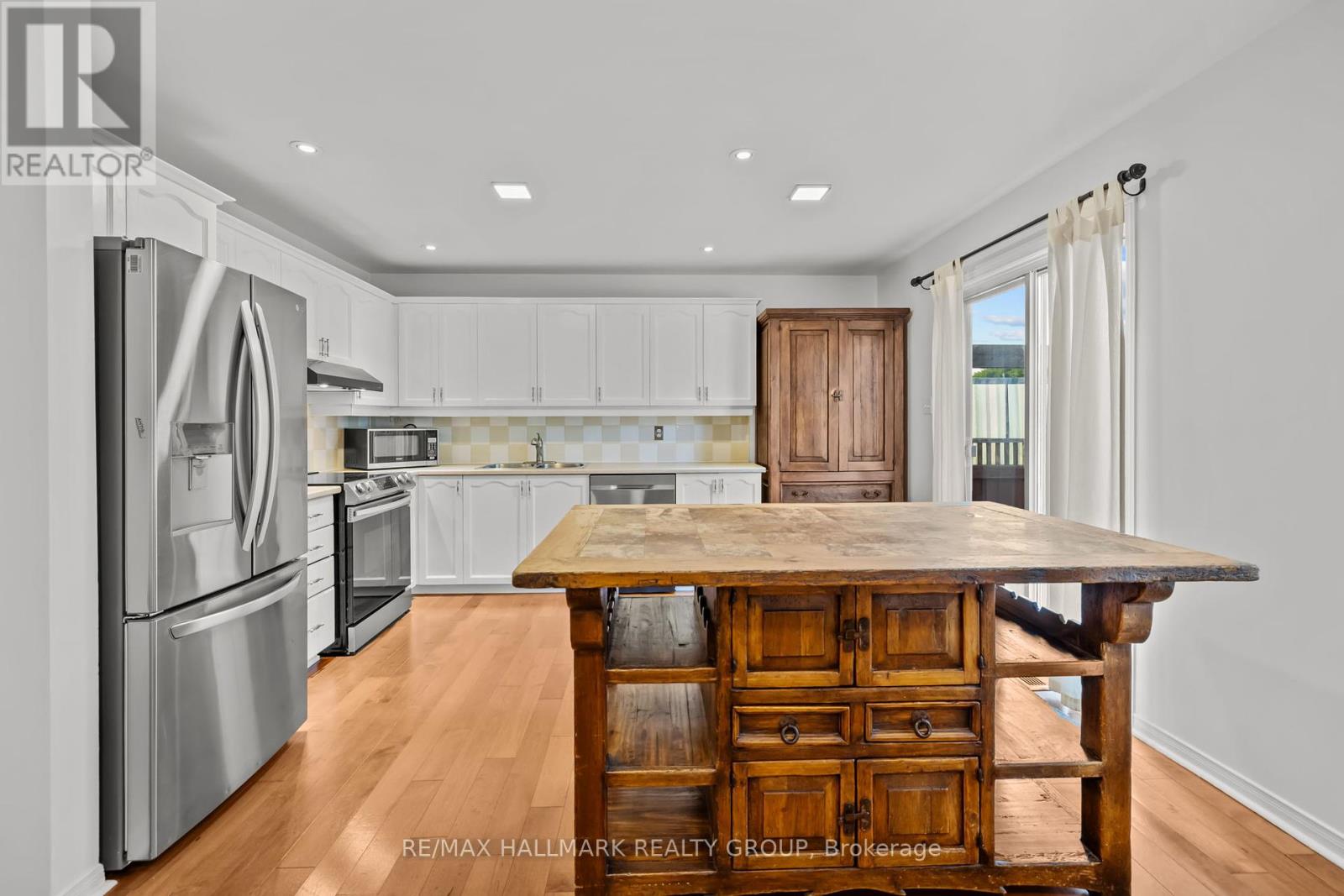Real wood cabinets in kitchen and bathrooms