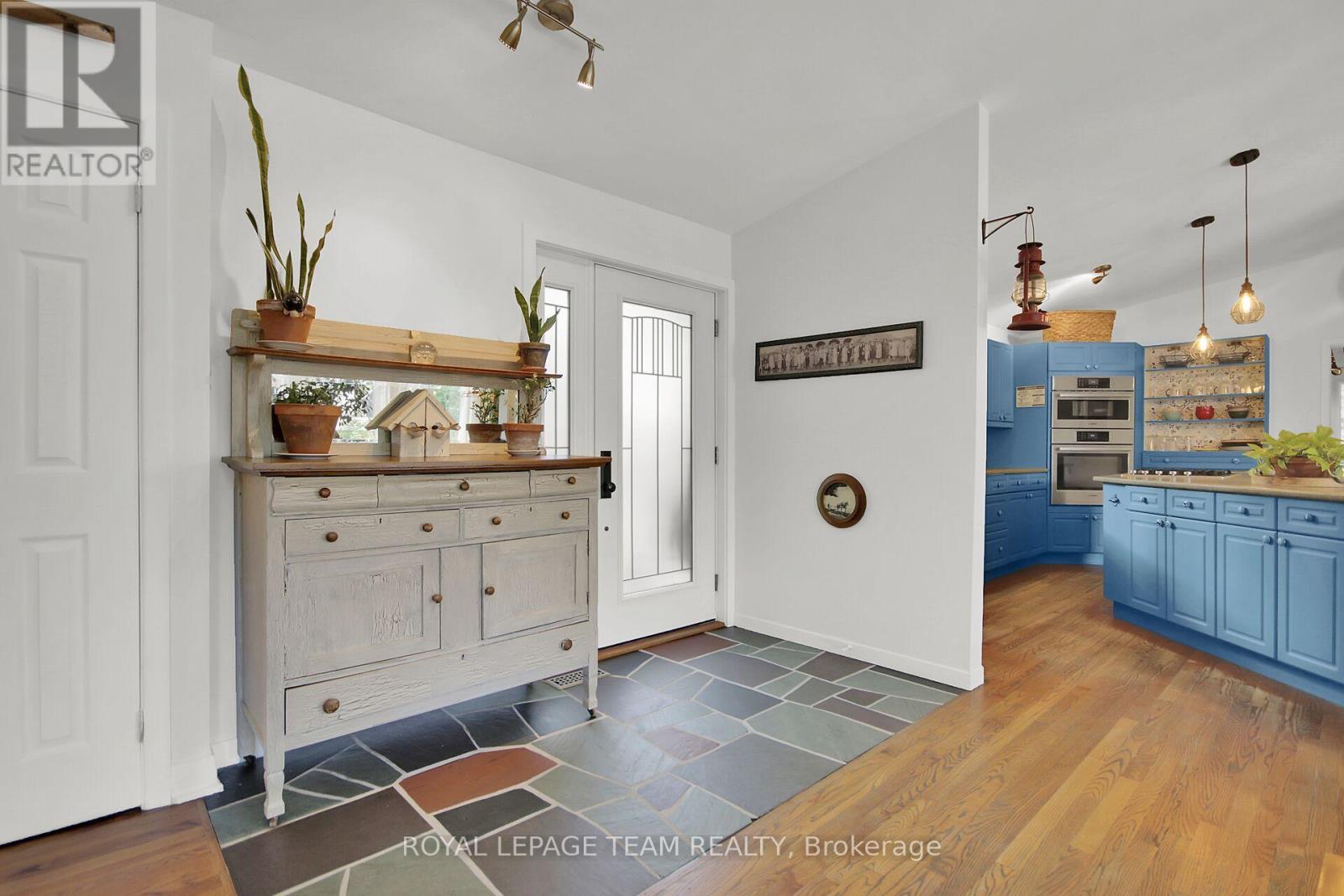 Tiled Foyer leads to open concept living space.
