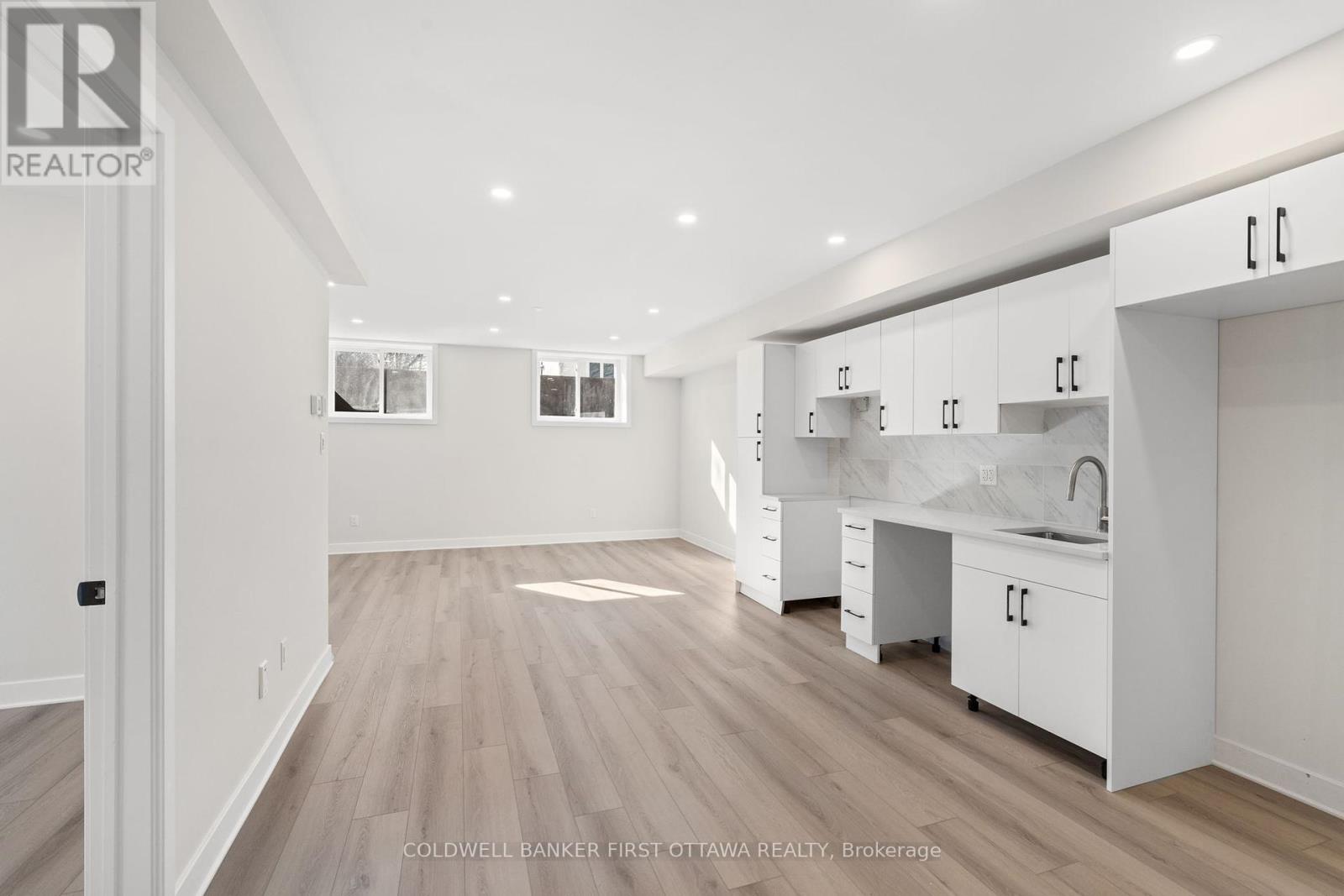 Lower Level unit w bright windows and pot lights.