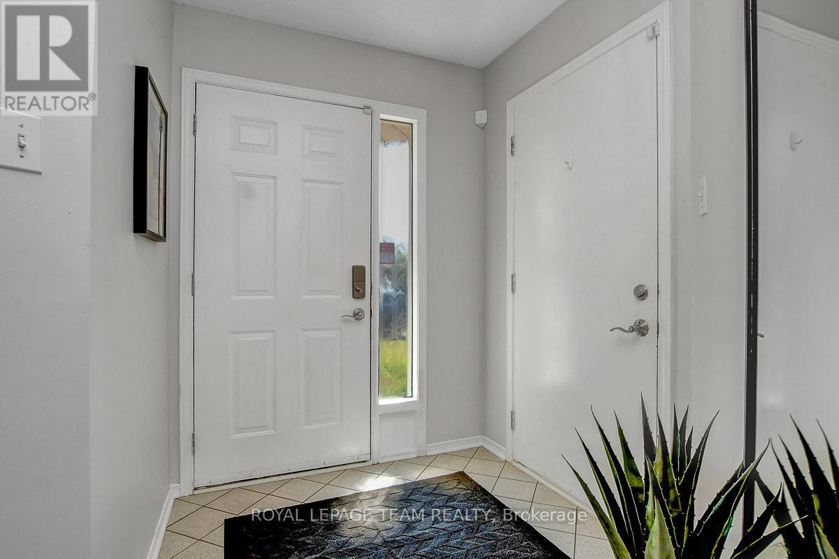 Front foyer showing inside access to the garage.