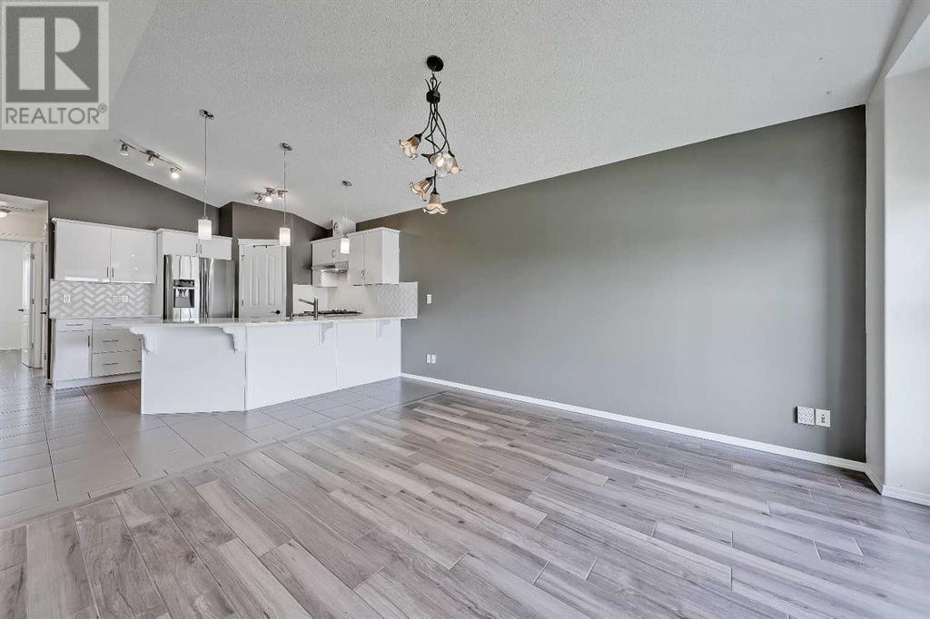 Single Family House Bungalow for Sale in  Cramond Green SE Cranston Calgary 