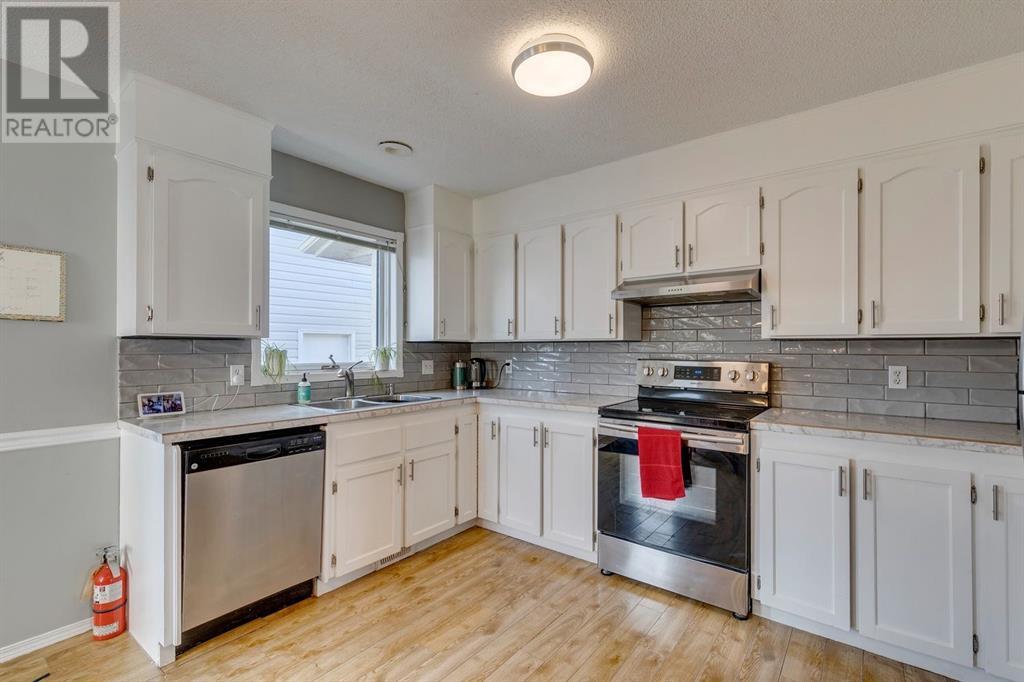 Single Family House 4 Level for Sale in  Hawkville Close NW Hawkwood Calgary 