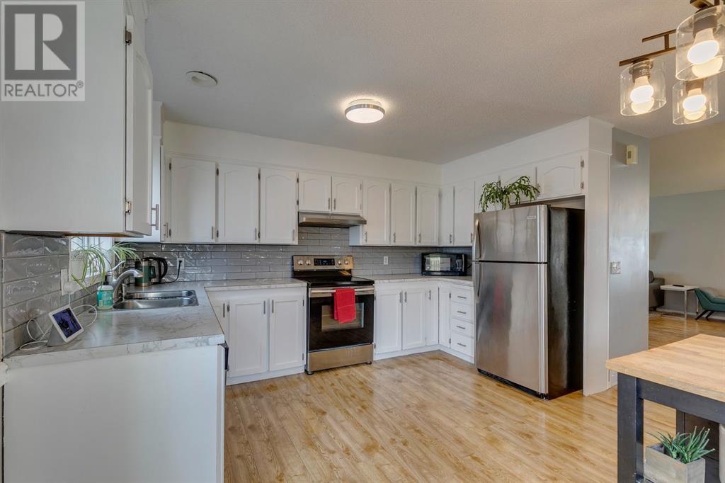 Single Family House 4 Level for Sale in  Hawkville Close NW Hawkwood Calgary 