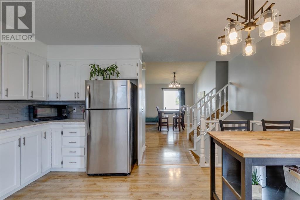 Single Family House 4 Level for Sale in  Hawkville Close NW Hawkwood Calgary 