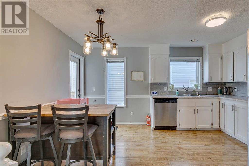 Single Family House 4 Level for Sale in  Hawkville Close NW Hawkwood Calgary 