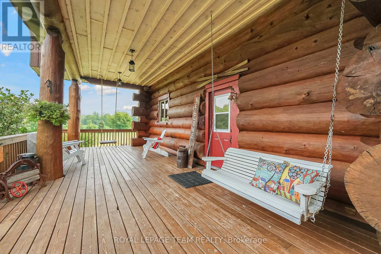 Welcoming front porch with a couple of swings