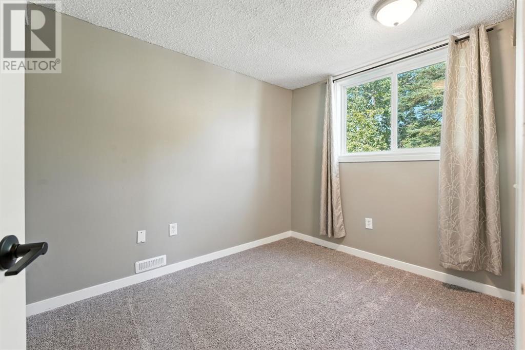 Single Family House Bi-level for Sale in A  Braxton Place SW Braeside Calgary 
