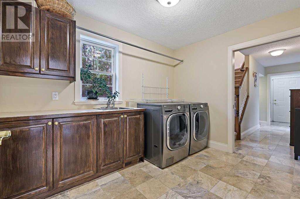 Single Family House for Sale in  Slopeview Drive SW Springbank Hill Calgary 