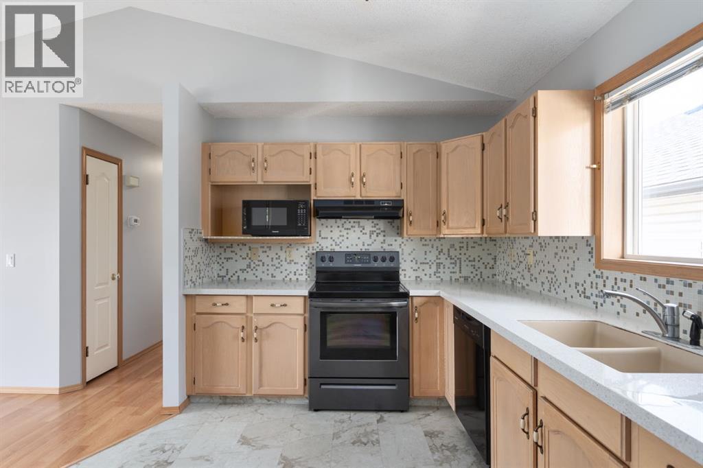 Single Family House Bi-level for Sale in  Erin Circle SE Erin Woods Calgary 