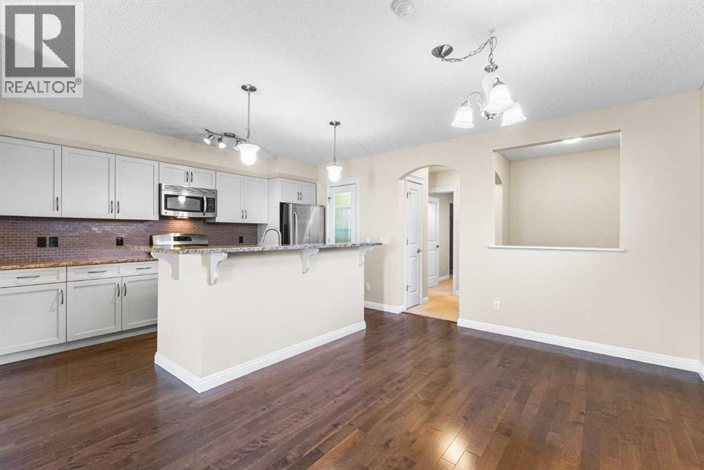Single Family House Bungalow for Sale in  Mike Ralph Way SW Garrison Green Calgary 