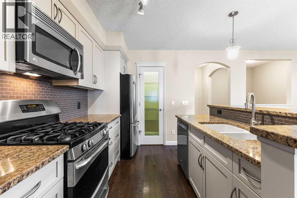 Single Family House Bungalow for Sale in  Mike Ralph Way SW Garrison Green Calgary 