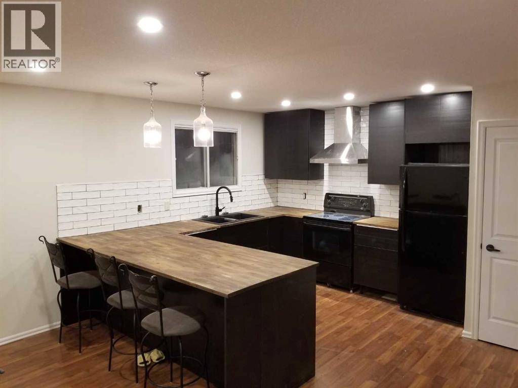 Multi-family House Bi-level for Sale in   Avenue NW Bowness Calgary 